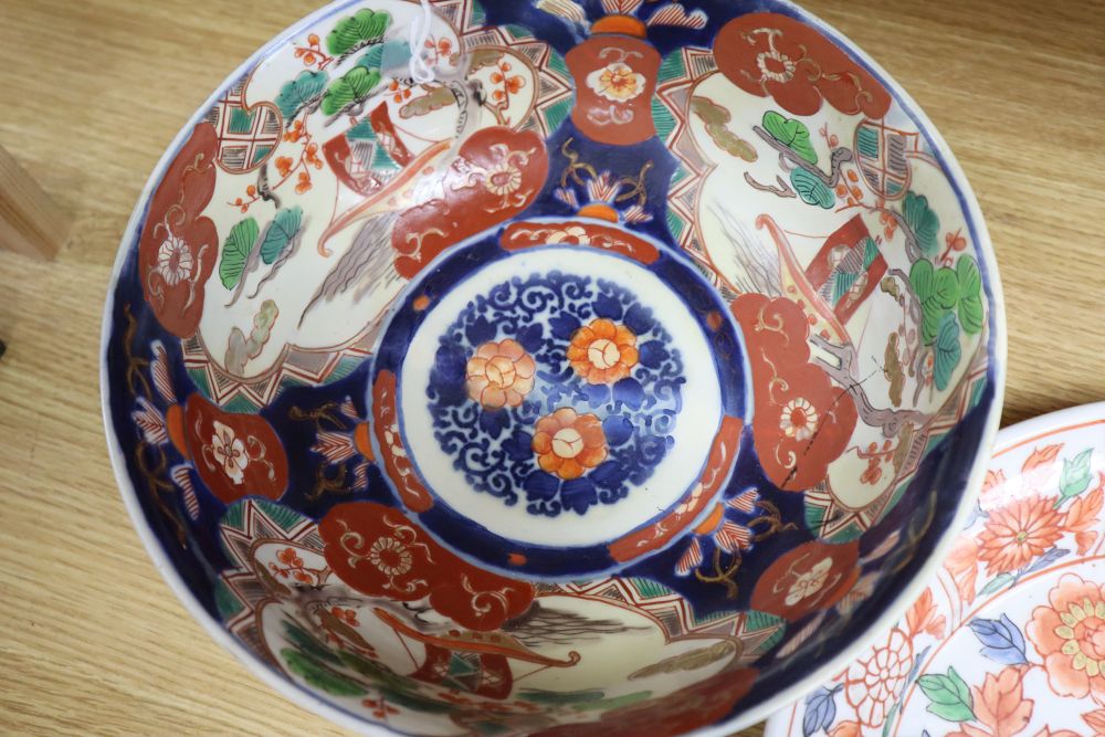 A Japanese Imari oval dish with six-character mark to base and six other items of Japanese Imari